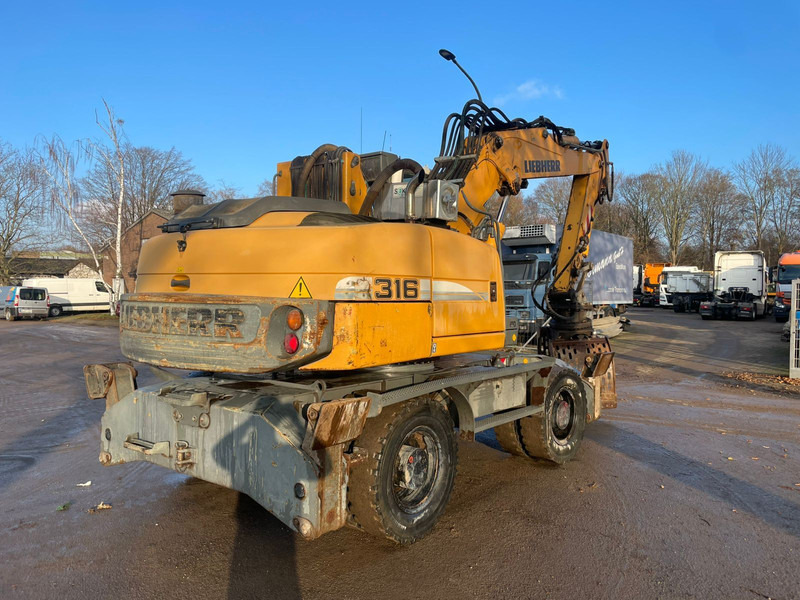 Liebherr A 316 - Escavadeira de rodas: foto 3 Liebherr A 316 - Escavadeira de rodas: foto 3