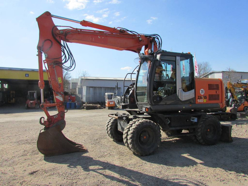 Hitachi ZX 140 W-3 Mobilbagger 45.000 EUR / Klima - Escavadeira de rodas: foto 1 Hitachi ZX 140 W-3 Mobilbagger 45.000 EUR / Klima - Escavadeira de rodas: foto 1