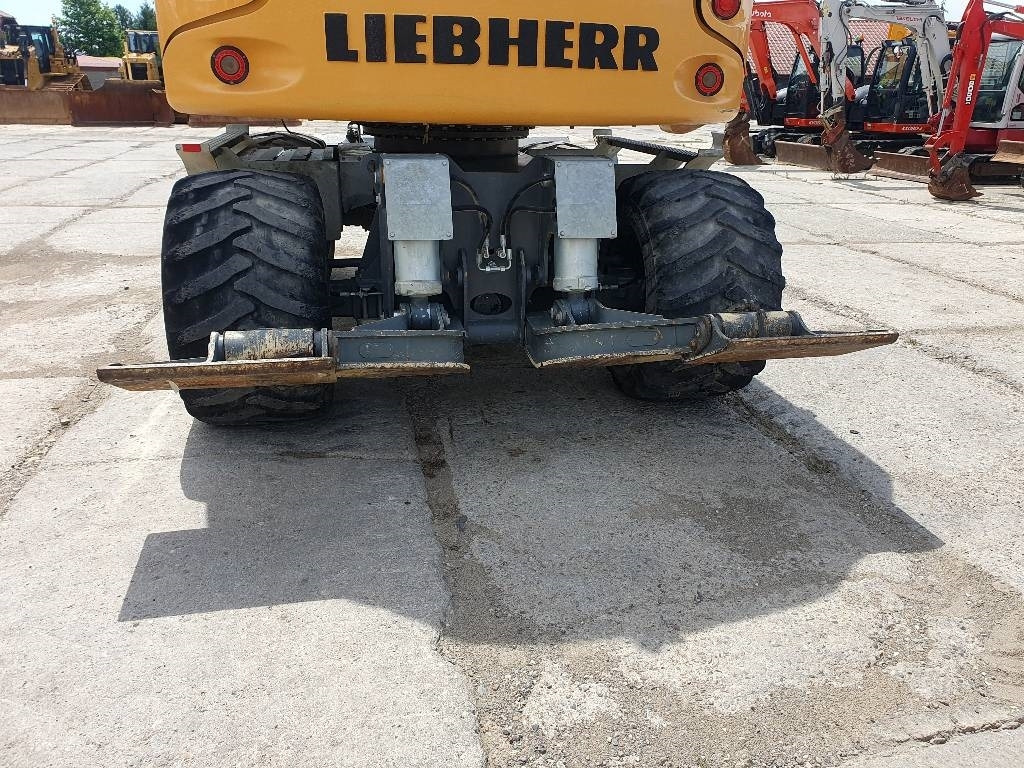 Escavadeira de rodas Liebherr A 910 Compact: foto 12