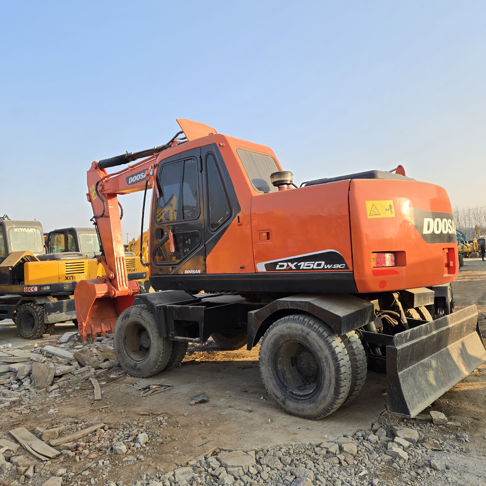 Doosan DX150W-9C - Escavadeira de rodas: foto 2 Doosan DX150W-9C - Escavadeira de rodas: foto 2