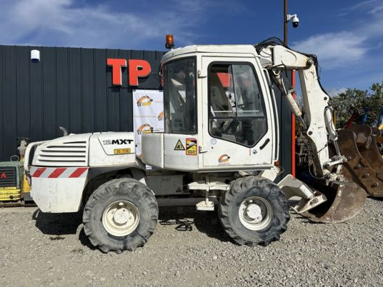 Mecalac 12MXT - Déport - Caméra x 2 - Escavadeira de rodas: foto 1 Mecalac 12MXT - Déport - Caméra x 2 - Escavadeira de rodas: foto 1