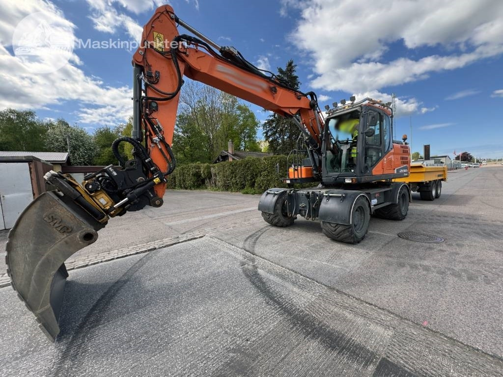 Doosan DX 160 W - Escavadeira de rodas: foto 1 Doosan DX 160 W - Escavadeira de rodas: foto 1