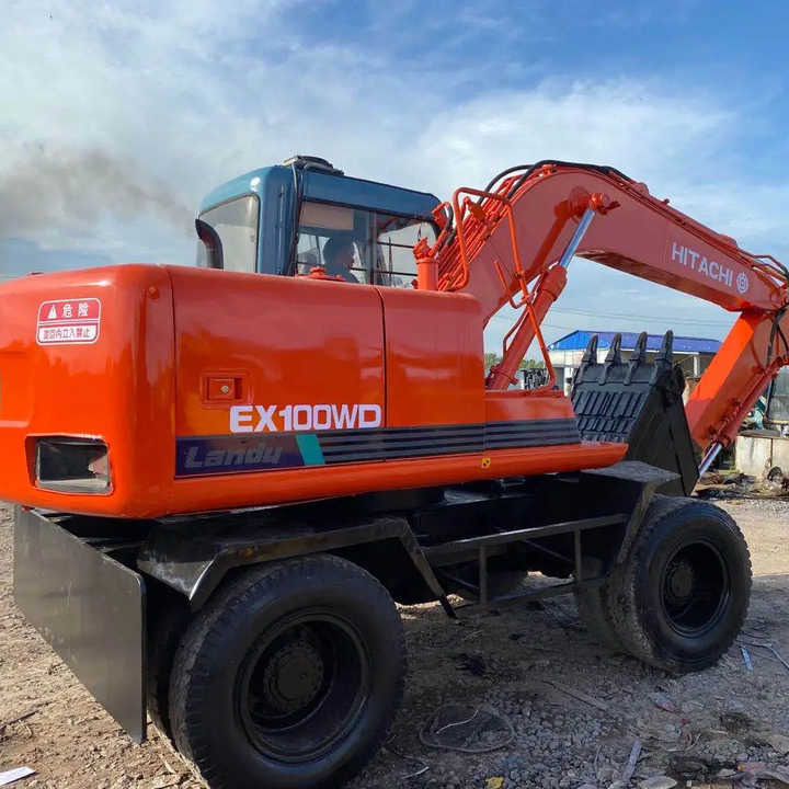 Used Hitachi Ex100WD Wheel Excavator for Sale Japan Made Hitachi Ex100wd Wheeled Excavator for Sale - Escavadora de rastos: foto 1 Used Hitachi Ex100WD Wheel Excavator for Sale Japan Made Hitachi Ex100wd Wheeled Excavator for Sale - Escavadora de rastos: foto 1