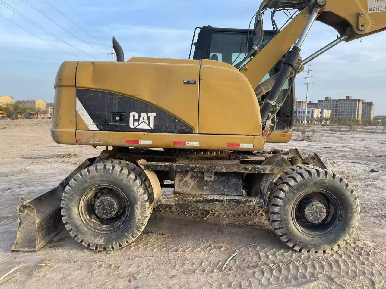 CATERPILLAR M315 - Escavadeira de rodas: foto 1 CATERPILLAR M315 - Escavadeira de rodas: foto 1