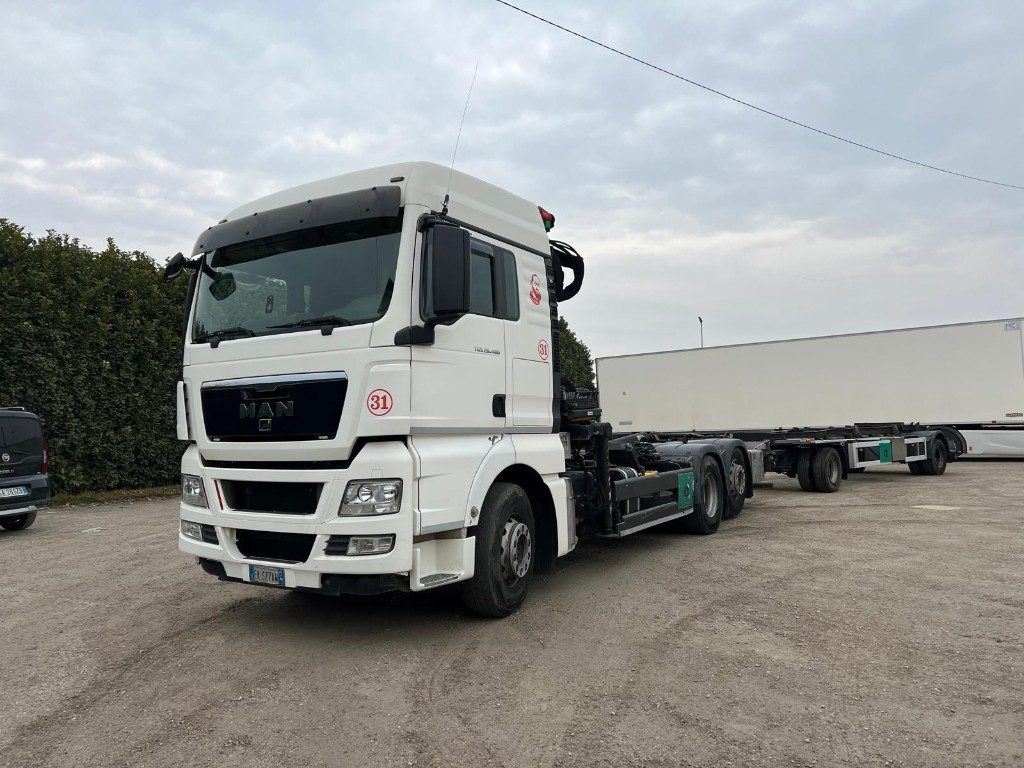 MAN TGX 26.480 SCARRABILE CON GRU - Caminhão polibenne: foto 1 MAN TGX 26.480 SCARRABILE CON GRU - Caminhão polibenne: foto 1