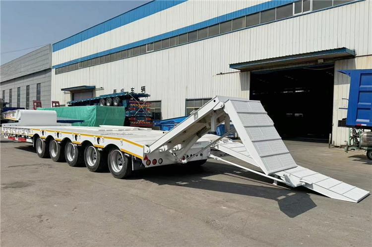 TITAN 5 Axle 100 Ton Low Bed Trailer for Sale In Tanzania - Semireboque baixa: foto 1 TITAN 5 Axle 100 Ton Low Bed Trailer for Sale In Tanzania - Semireboque baixa: foto 1
