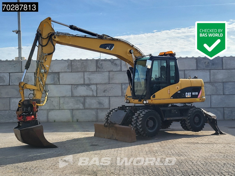 Caterpillar M313 D OUTRIGGERS + BLADE - Escavadeira de rodas: foto 1 Caterpillar M313 D OUTRIGGERS + BLADE - Escavadeira de rodas: foto 1