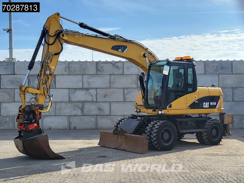 Caterpillar M313 D OUTRIGGERS + BLADE - Escavadeira de rodas: foto 2 Caterpillar M313 D OUTRIGGERS + BLADE - Escavadeira de rodas: foto 2