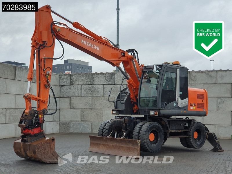 Hitachi ZX140W -3 OUTRIGGERS - ROTOTILT - Escavadeira de rodas: foto 1 Hitachi ZX140W -3 OUTRIGGERS - ROTOTILT - Escavadeira de rodas: foto 1