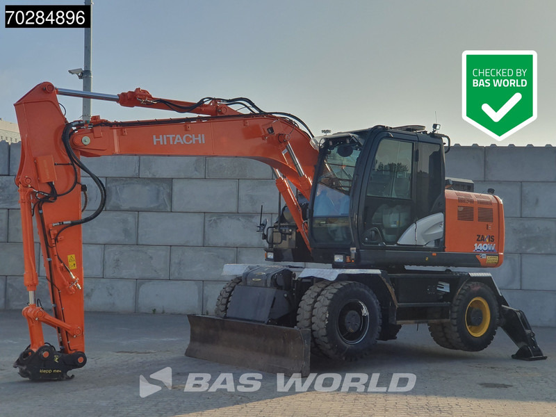 Hitachi ZX140W -6 OUTRIGGERS + BLADE - Escavadeira de rodas: foto 1 Hitachi ZX140W -6 OUTRIGGERS + BLADE - Escavadeira de rodas: foto 1