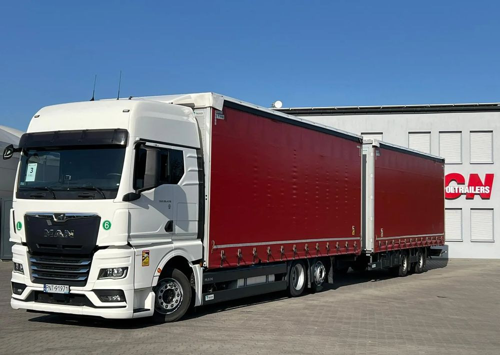 MAN TGX 26.470 z przyczepą Redos - Caminhão com lona: foto 1 MAN TGX 26.470 z przyczepą Redos - Caminhão com lona: foto 1