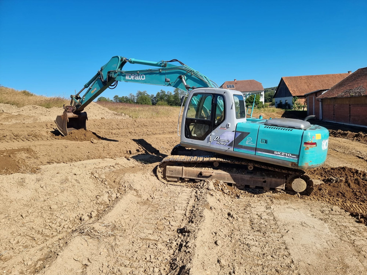 KOBELCO SK 210 NLC-6E - Escavadora de rastos: foto 1 KOBELCO SK 210 NLC-6E - Escavadora de rastos: foto 1