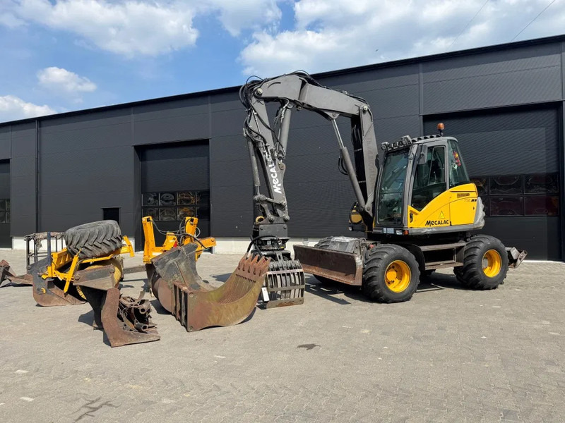 Mecalac 714MW FULL ATTACHMENTS OVERCOMPLEET !!! - Escavadeira de rodas: foto 2 Mecalac 714MW FULL ATTACHMENTS OVERCOMPLEET !!! - Escavadeira de rodas: foto 2