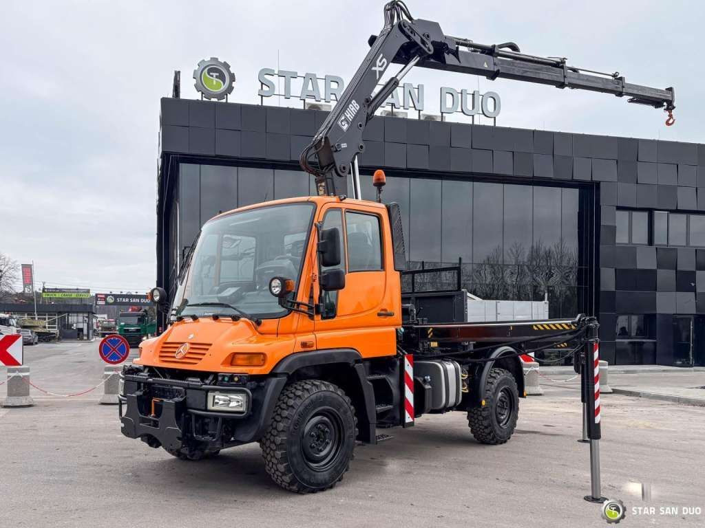 Unimog Mercedes-Benz UNIMOG U300 4x4 HIAB 122 D-3 CRANE Unimog Mercedes-Benz UNIMOG U300 4x4 HIAB 122 D-3 CRANE - Caminhão grua, Camião de caixa aberta/ Plataforma: foto 1 Unimog Mercedes-Benz UNIMOG U300 4x4 HIAB 122 D-3 CRANE Unimog Mercedes-Benz UNIMOG U300 4x4 HIAB 122 D-3 CRANE - Caminhão grua, Camião de caixa aberta/ Plataforma: foto 1