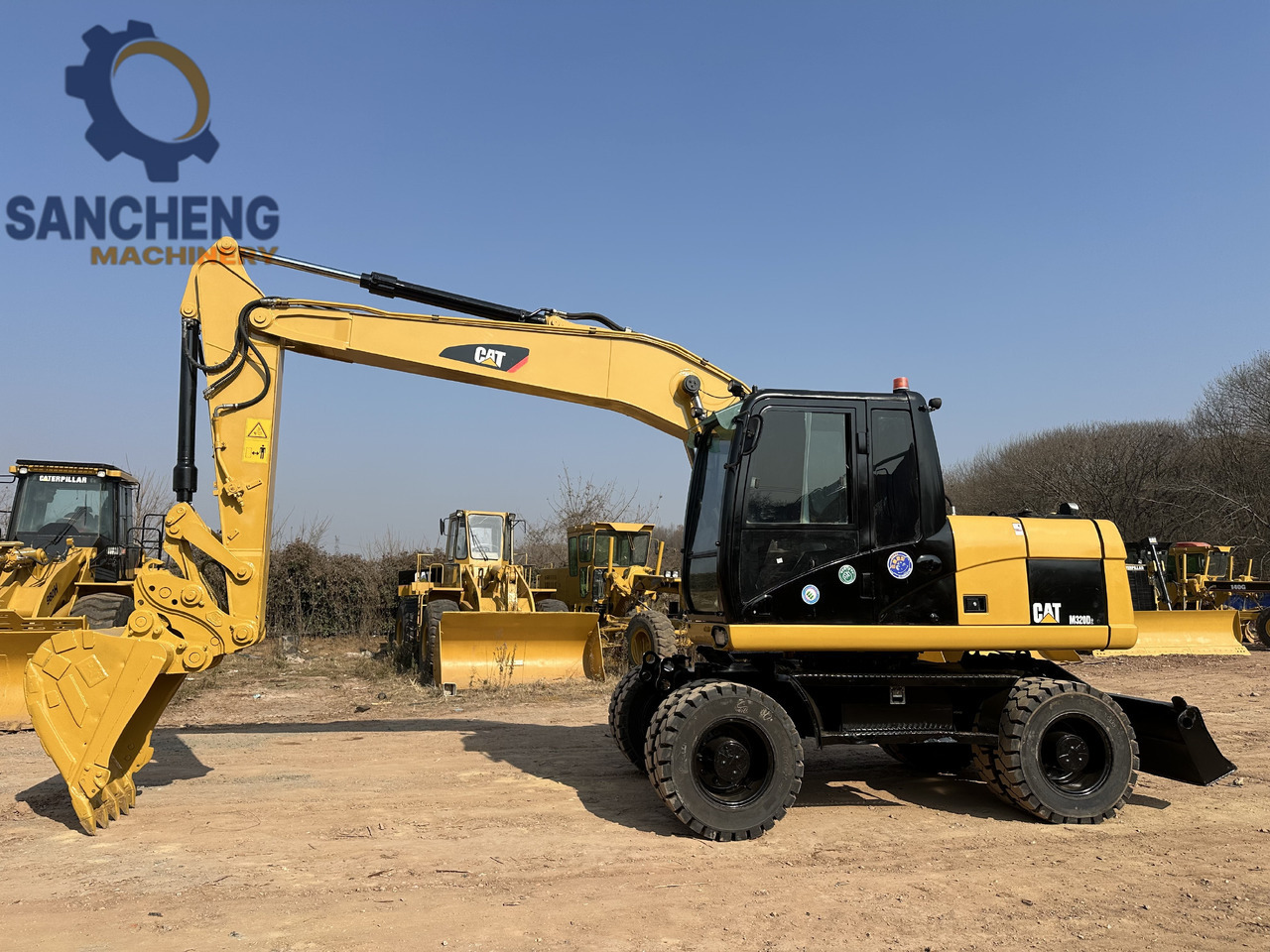 CATERPILLAR M320D2 - Escavadeira de rodas: foto 2 CATERPILLAR M320D2 - Escavadeira de rodas: foto 2