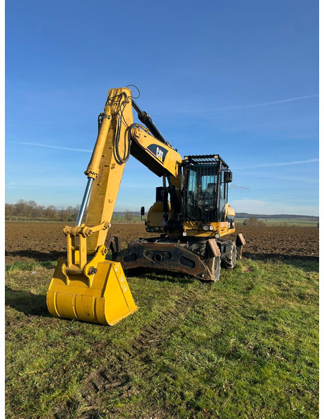 Caterpillar M322D VAH - Escavadeira de rodas: foto 1 Caterpillar M322D VAH - Escavadeira de rodas: foto 1