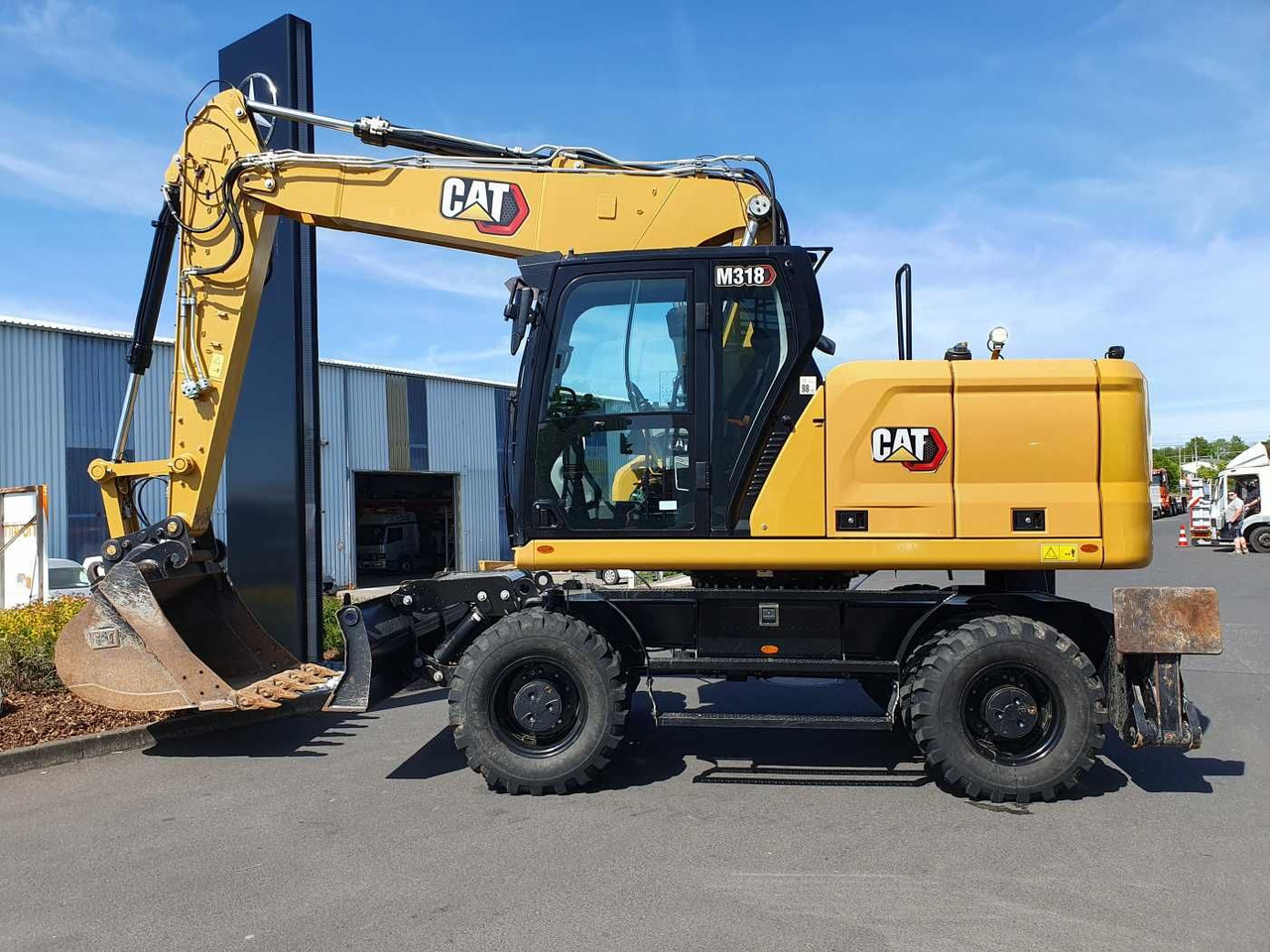 CAT M318 / 2022 / nur 286h! / Tieflöffel / Pratzen - Escavadeira de rodas: foto 2 CAT M318 / 2022 / nur 286h! / Tieflöffel / Pratzen - Escavadeira de rodas: foto 2