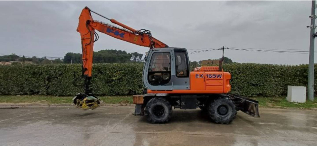 FIAT ALLIS / NEW HOLLAND EX165W - Escavadeira de rodas: foto 1 FIAT ALLIS / NEW HOLLAND EX165W - Escavadeira de rodas: foto 1