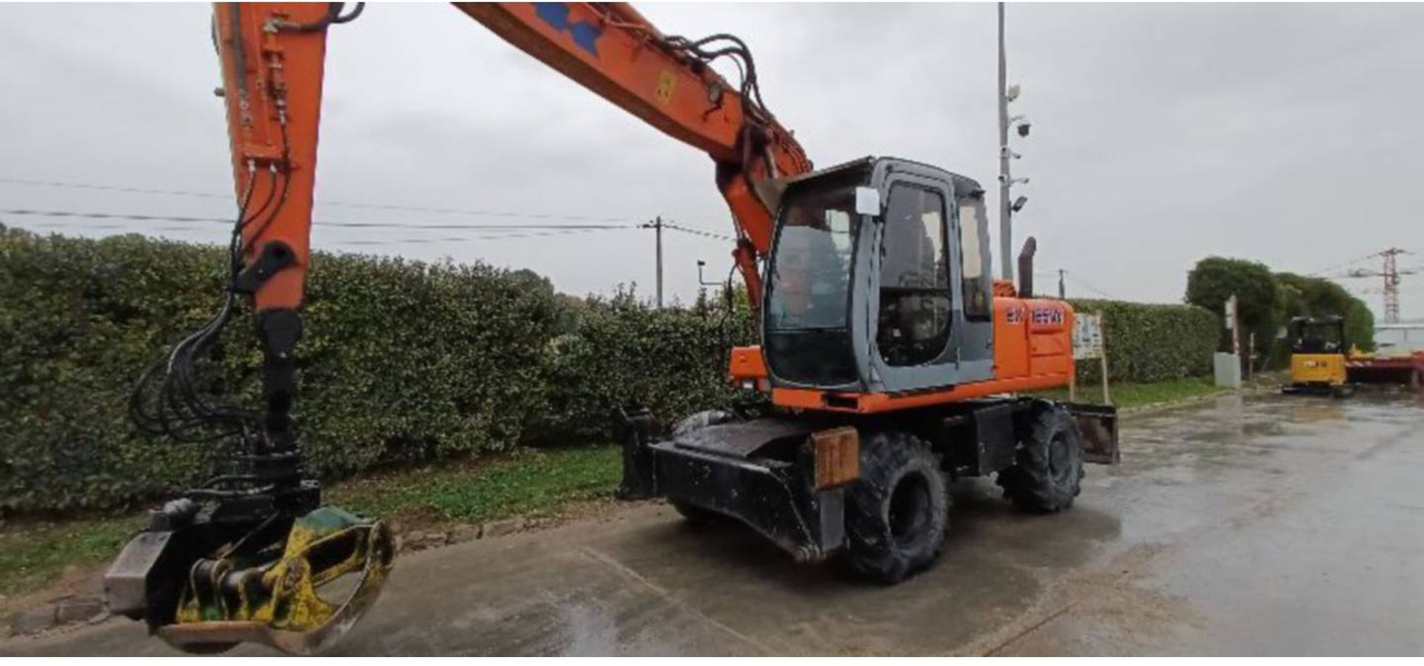 FIAT ALLIS / NEW HOLLAND EX165W - Escavadeira de rodas: foto 2 FIAT ALLIS / NEW HOLLAND EX165W - Escavadeira de rodas: foto 2