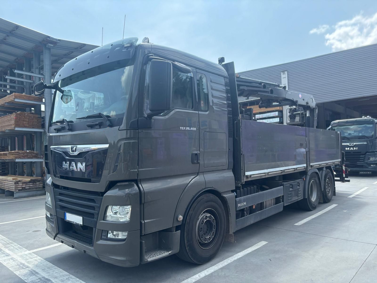 MAN 26.460 TGX Baustoffkran HMF 2110-L3 - Caminhão grua: foto 1 MAN 26.460 TGX Baustoffkran HMF 2110-L3 - Caminhão grua: foto 1